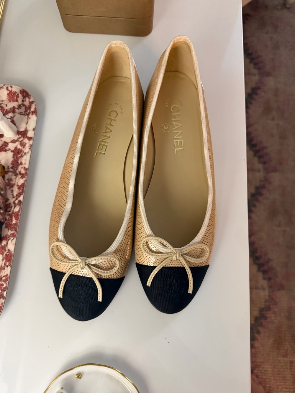 CHANEL Beige and Black Cap-Toe Ballet Flats with Bow